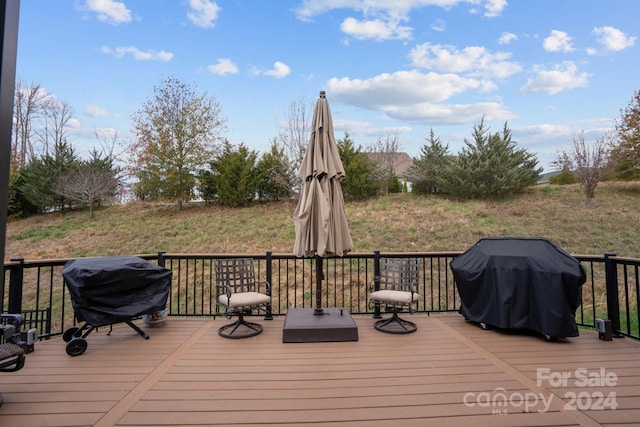 wooden terrace featuring grilling area