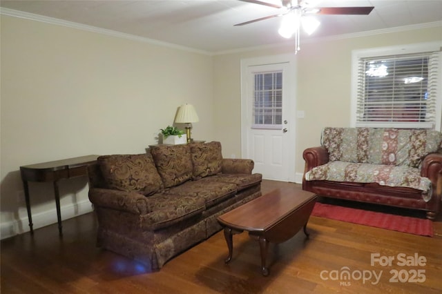 living room featuring ceiling fan, ornamental molding, wood finished floors, and baseboards