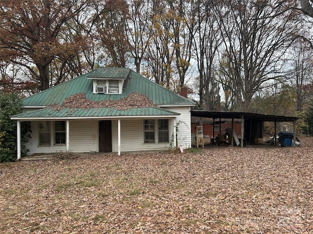 view of outbuilding with covered porch and a carport