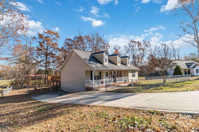 new england style home with a porch