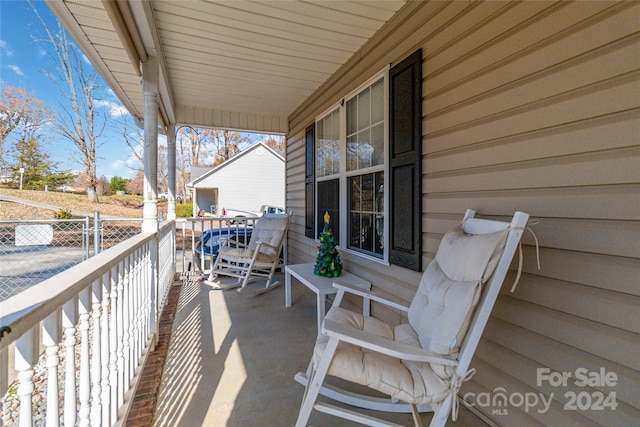 view of patio featuring a porch