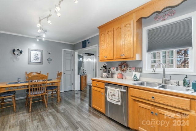 kitchen featuring dishwasher, light hardwood / wood-style flooring, ornamental molding, and sink