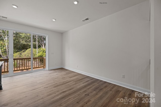 spare room with wood-type flooring