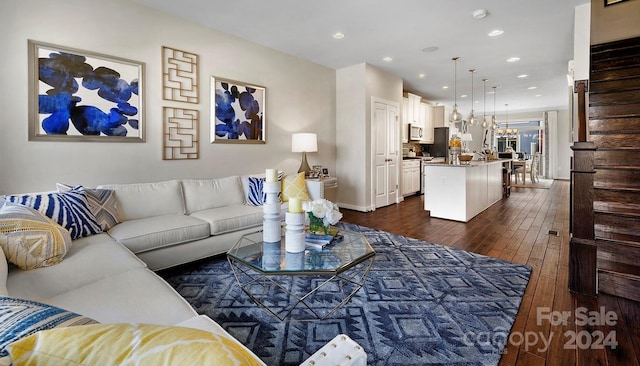 living room with dark hardwood / wood-style floors