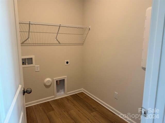 clothes washing area featuring hookup for an electric dryer, wood-type flooring, hookup for a washing machine, and gas dryer hookup