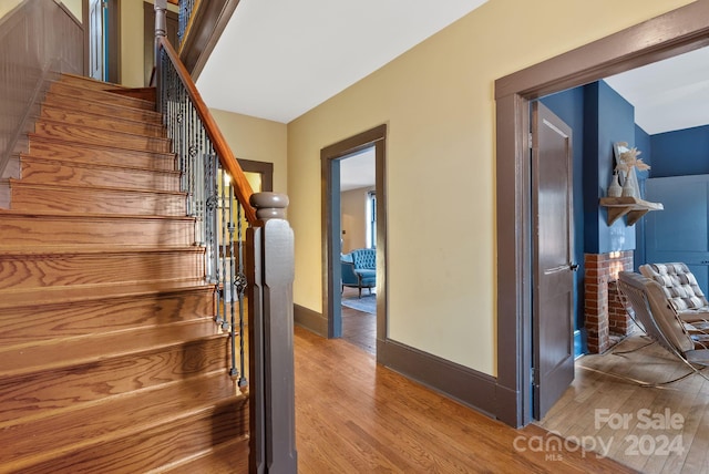 stairs with hardwood / wood-style flooring