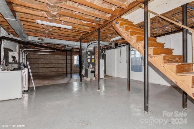 basement with separate washer and dryer and heating unit