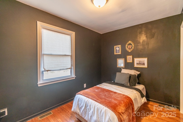 bedroom featuring wood-type flooring