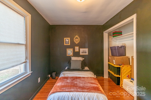 bedroom with hardwood / wood-style flooring