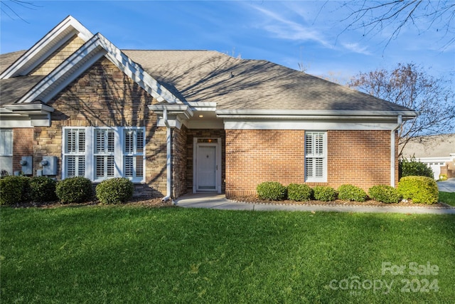 front facade with a front lawn