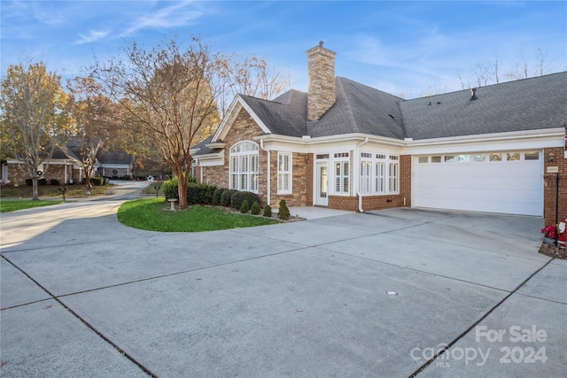 view of side of property featuring a garage