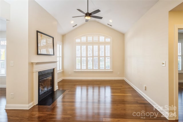 unfurnished living room with lofted ceiling, ceiling fan, and dark hardwood / wood-style floors