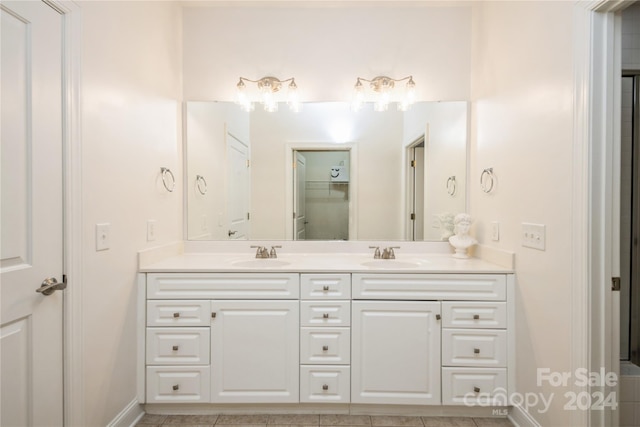 bathroom with tile patterned floors and vanity