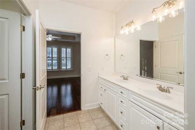 bathroom featuring hardwood / wood-style flooring, ceiling fan, and vanity