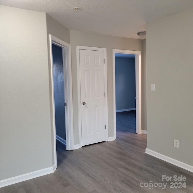 empty room featuring dark hardwood / wood-style floors