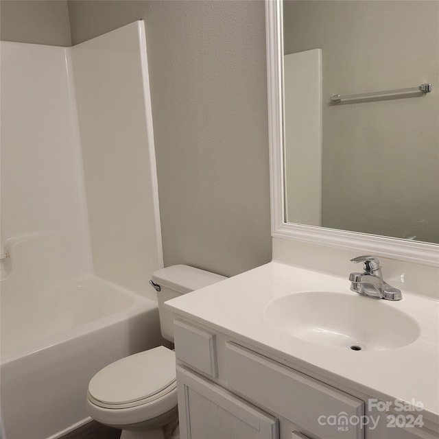 full bathroom with bathtub / shower combination, vanity, and toilet