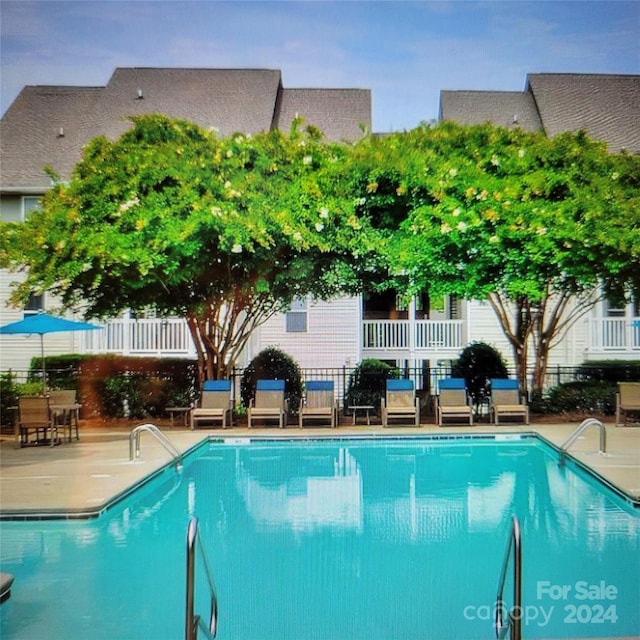 view of swimming pool featuring a patio