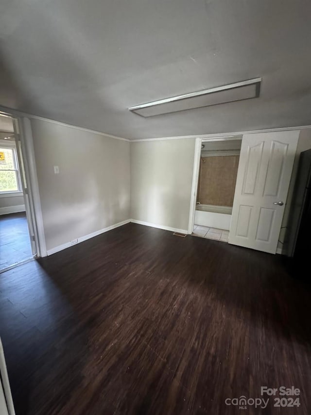 spare room with hardwood / wood-style flooring