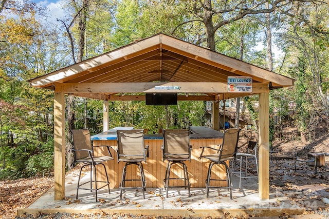 view of patio featuring a gazebo and a bar