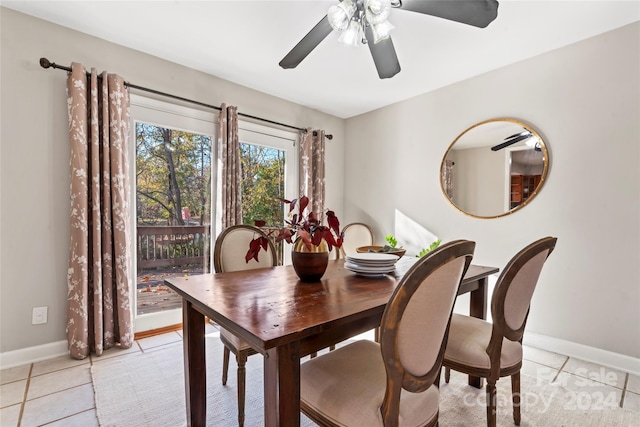 tiled dining room with ceiling fan