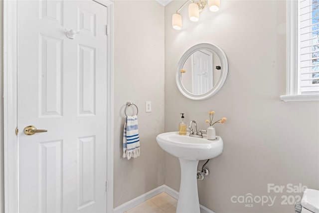 bathroom with tile patterned floors