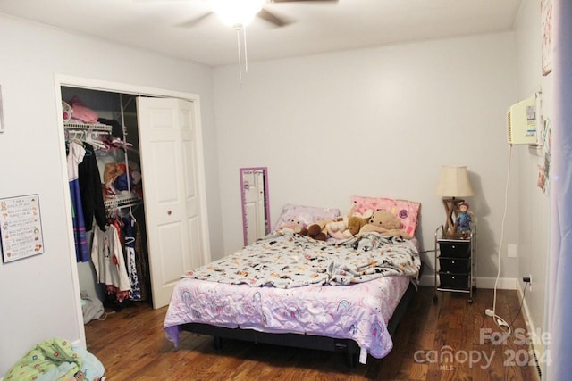 bedroom with dark hardwood / wood-style floors and ceiling fan