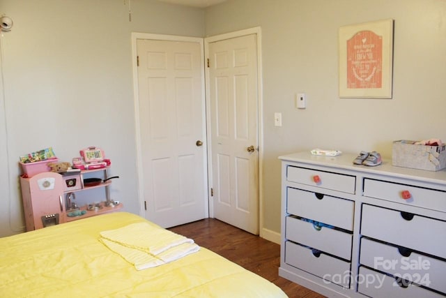 bedroom featuring dark wood-type flooring