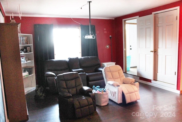 living room featuring crown molding and dark hardwood / wood-style flooring