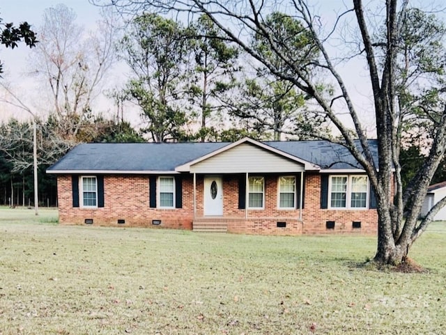 ranch-style home featuring a front yard