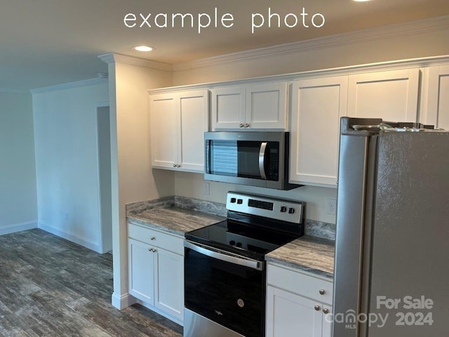 kitchen with crown molding, white cabinets, stainless steel appliances, and dark hardwood / wood-style floors