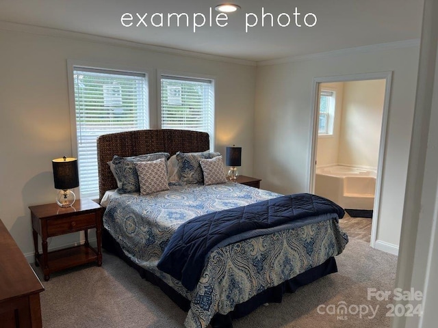 carpeted bedroom with crown molding and ensuite bathroom