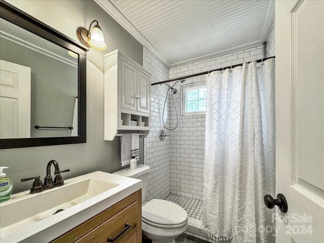 bathroom featuring vanity, toilet, walk in shower, and ornamental molding