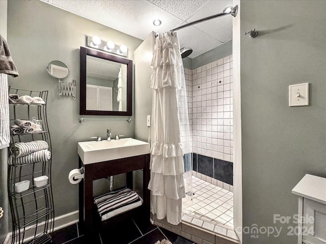 bathroom featuring a shower with shower curtain and tile patterned flooring