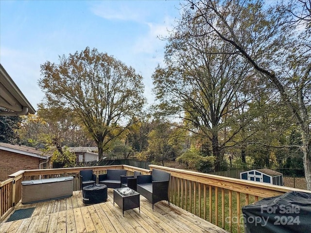 wooden terrace with an outdoor living space