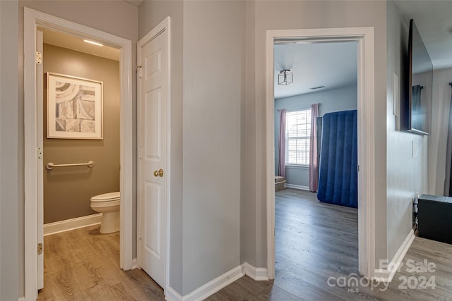 corridor featuring light hardwood / wood-style flooring