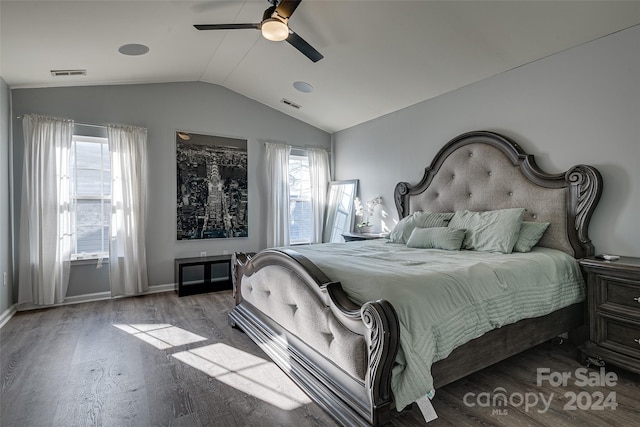 bedroom featuring multiple windows, ceiling fan, vaulted ceiling, and light wood-type flooring