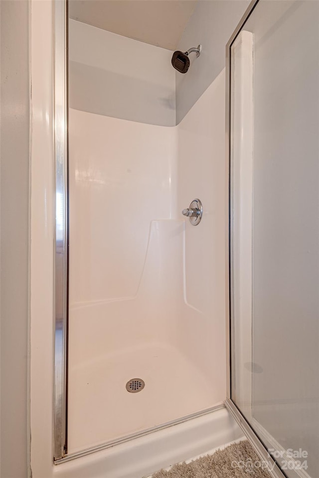 bathroom featuring walk in shower