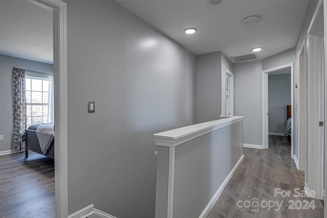 hallway with light hardwood / wood-style flooring