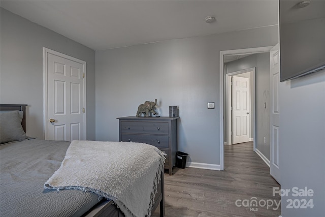 bedroom with light hardwood / wood-style floors