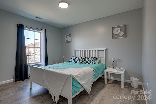 bedroom with wood-type flooring