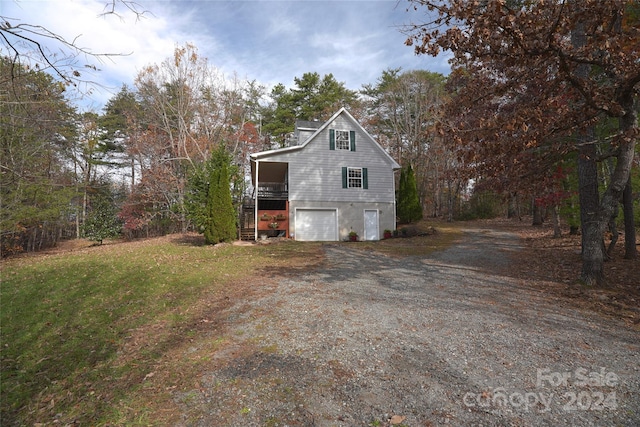 view of property exterior featuring a garage and a wooden deck