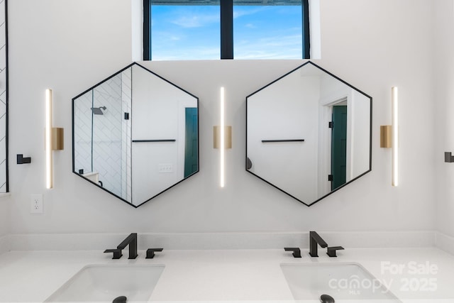 bathroom with vanity and a towering ceiling