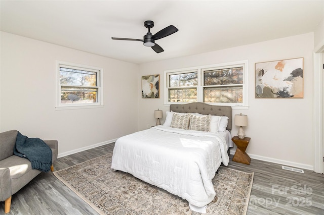 bedroom featuring ceiling fan and dark hardwood / wood-style flooring