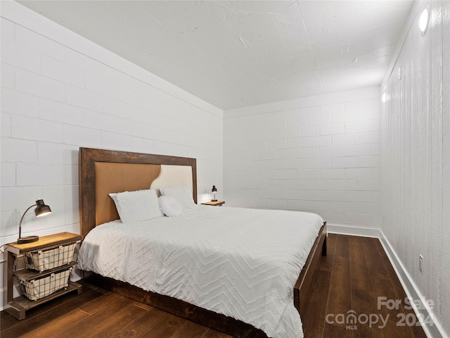 bedroom with hardwood / wood-style flooring