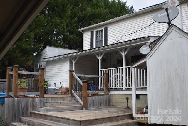 306 Mcadenville Rd, Lowell, NC 28098 - back of property featuring covered porch and stairway