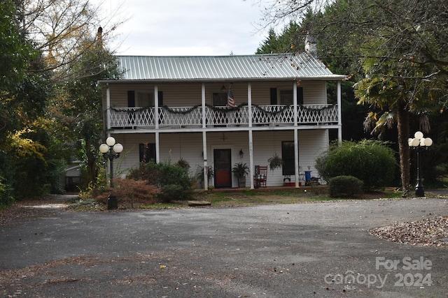 front of property with a balcony