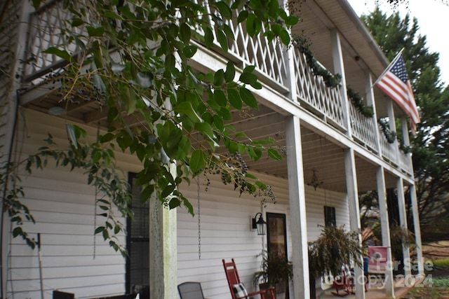 view of side of home with a balcony