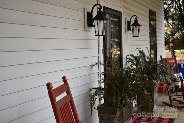 doorway to property featuring a porch