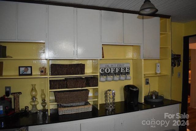 306 Mcadenville Rd, Lowell, NC 28098 - kitchen with open shelves, white cabinets, and dark countertops