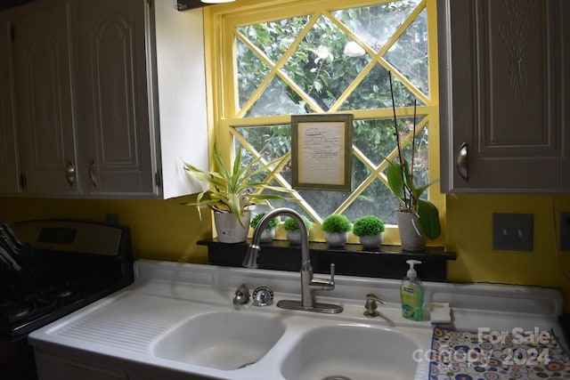 306 Mcadenville Rd, Lowell, NC 28098 - kitchen view of light countertops and washer / clothes dryer